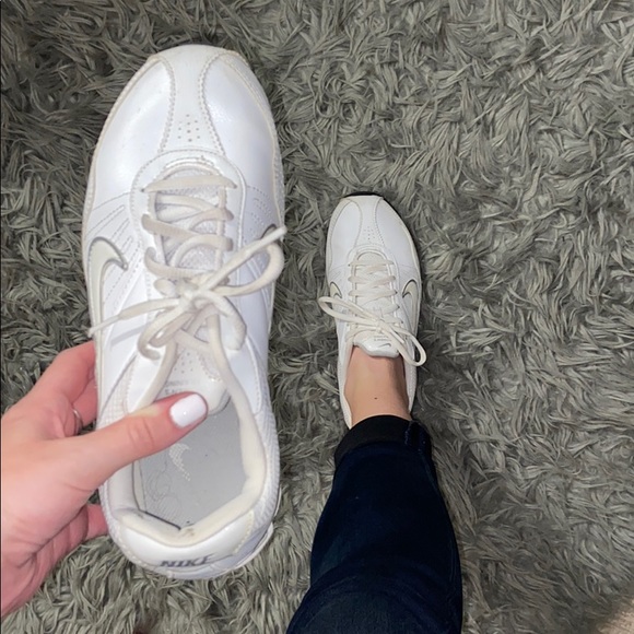 white tennis shoes with green back